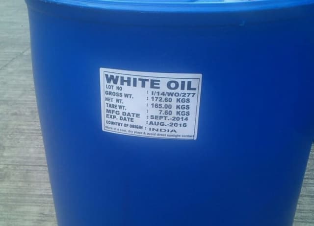 Blue drum of white oil with label details