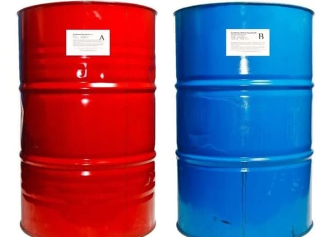 Two drums of epoxy resin, one red and one blue