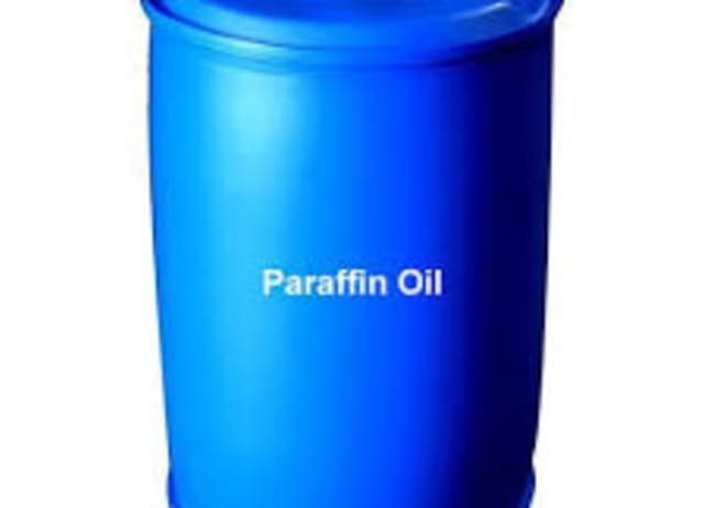Blue drum labeled as Paraffin Oil